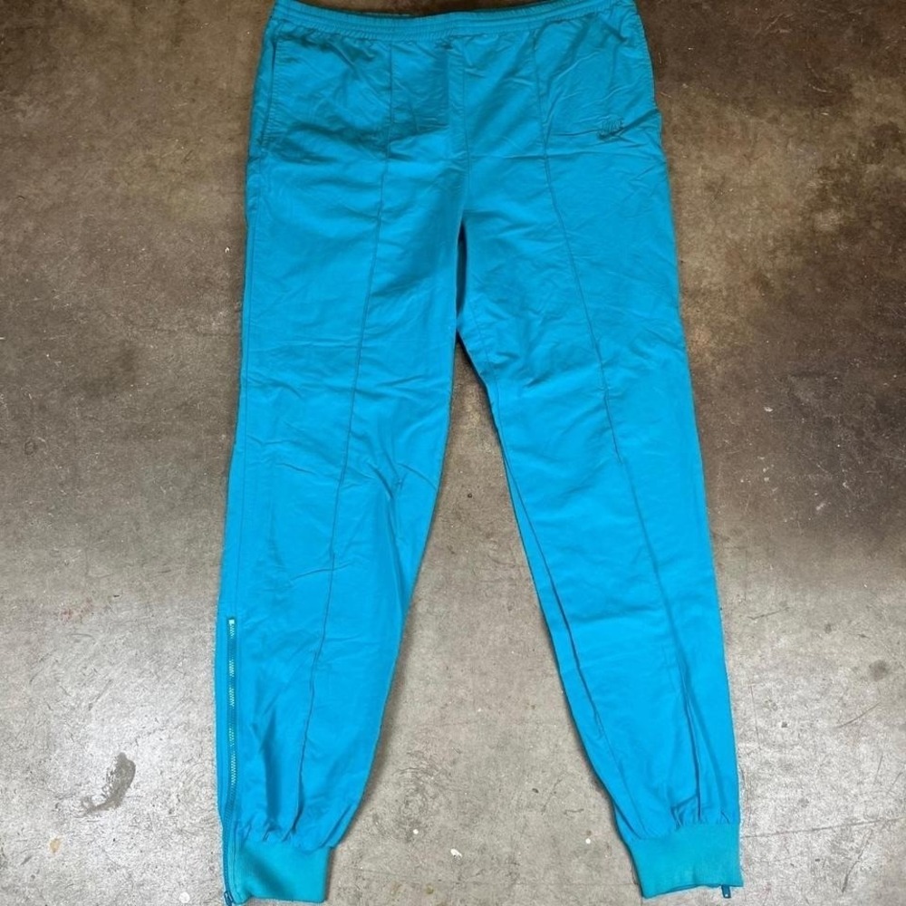 Vintage 90s Nike blue track pants with drawstring waist women's large